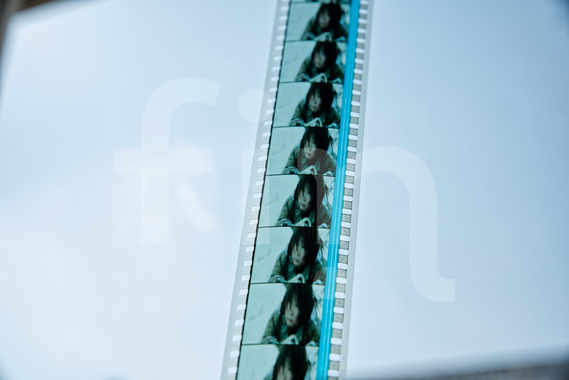 Close-up of a young person on film tape with audio