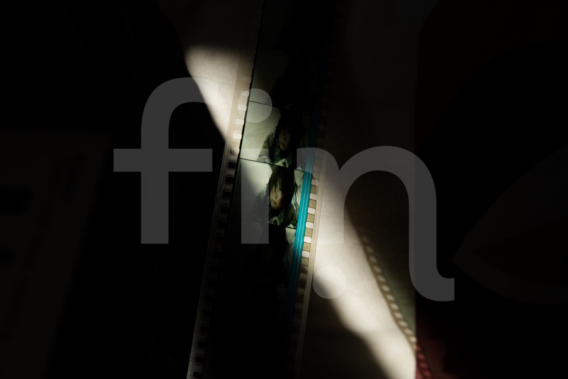 Close-up of a young person on film tape with audio