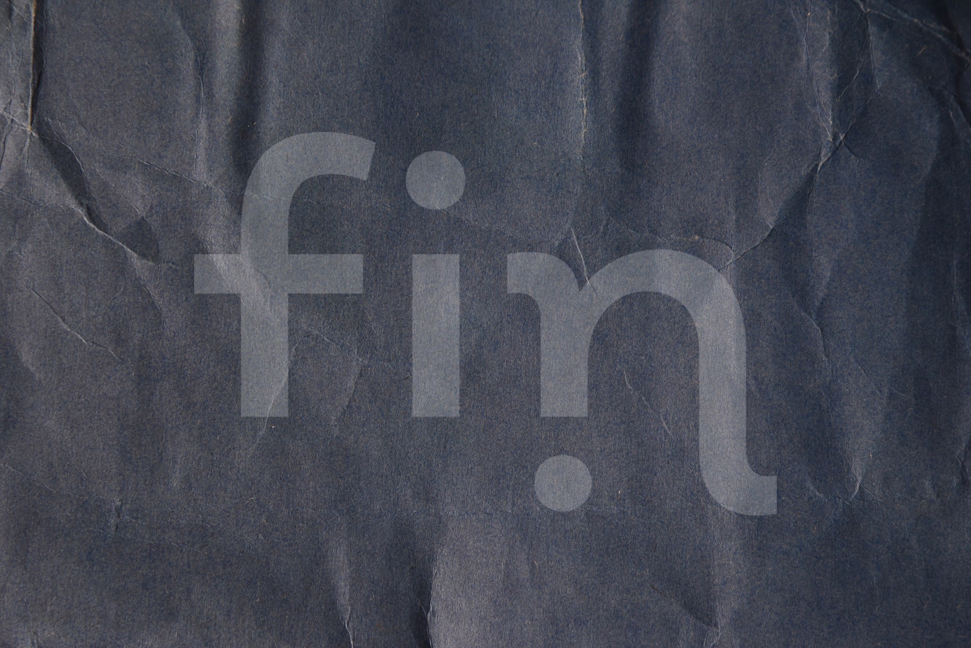 Texture of a surface of dark blue paper for a background and for wallpaper