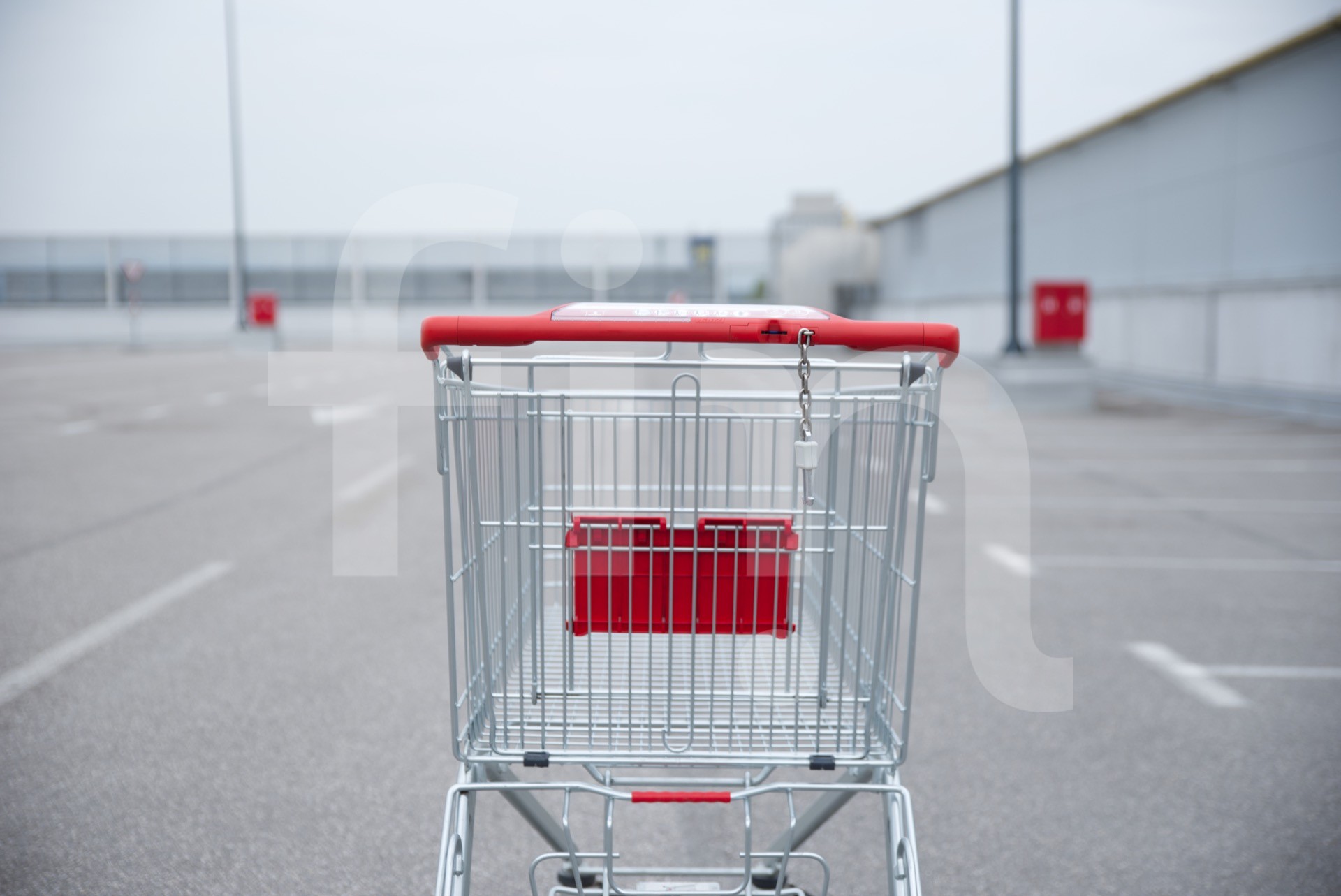 Red shopping cart on the road
