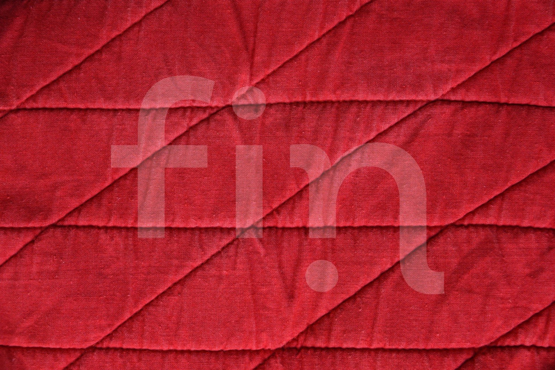 Red textile texture with stitched horizontal rhombuses texture