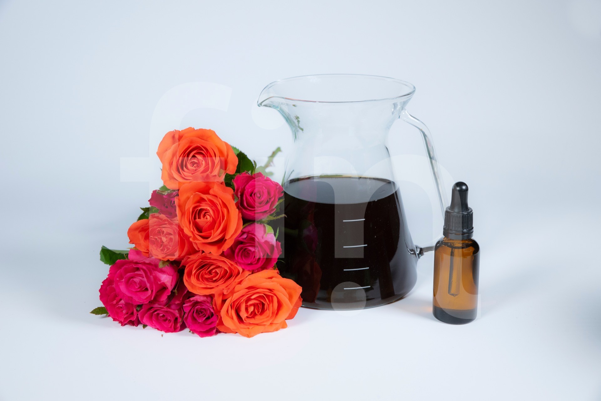 Rose tincture in a glass jar