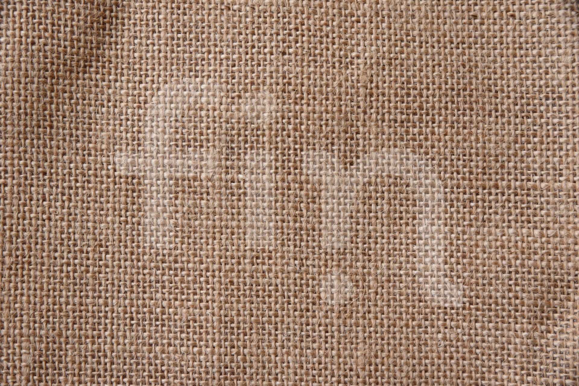 The texture of a brown beige jute bag