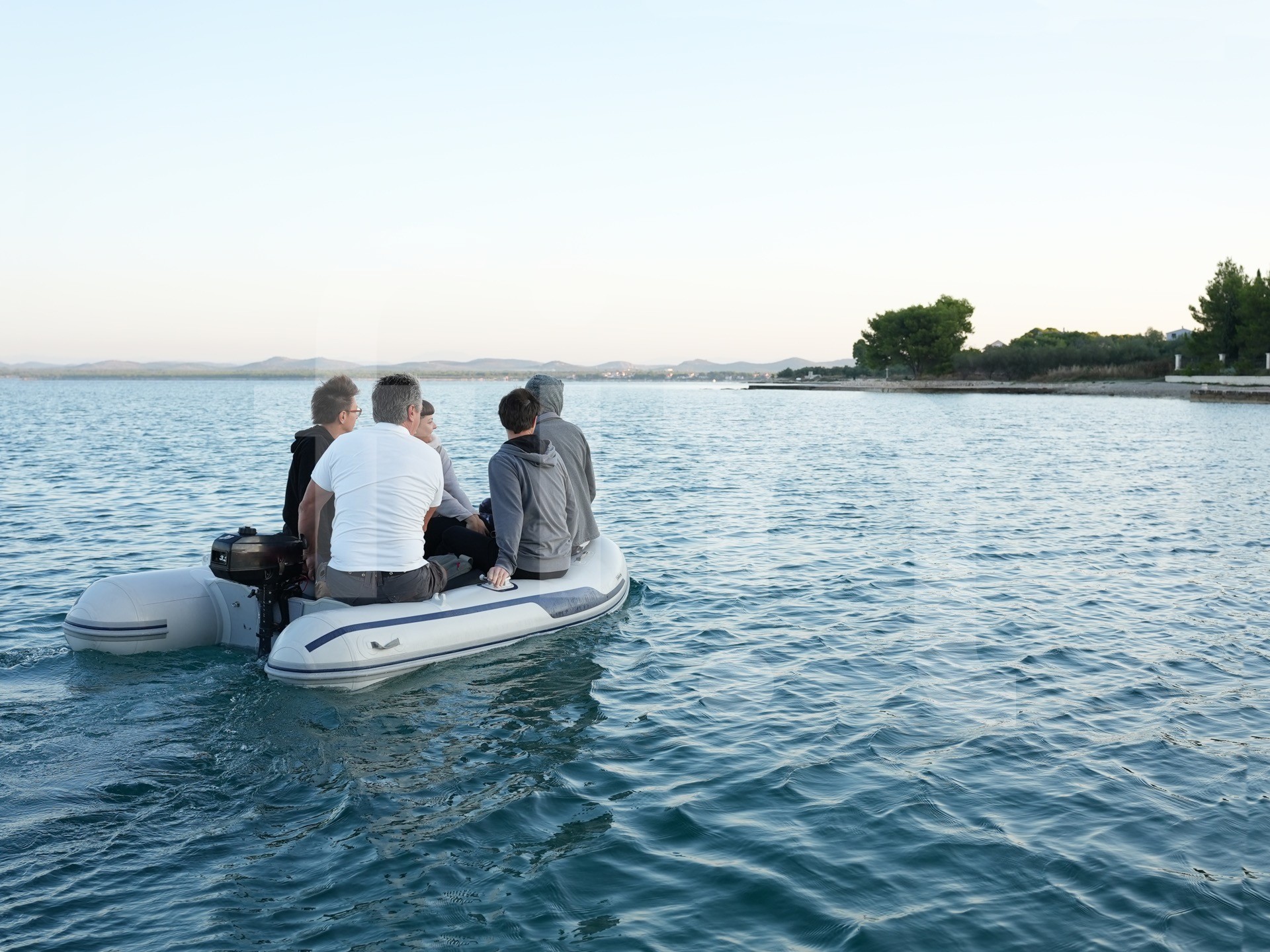 Transfering people from sailboat to shore in dinghy