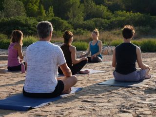 Yoga class outdoor meditation sunrise