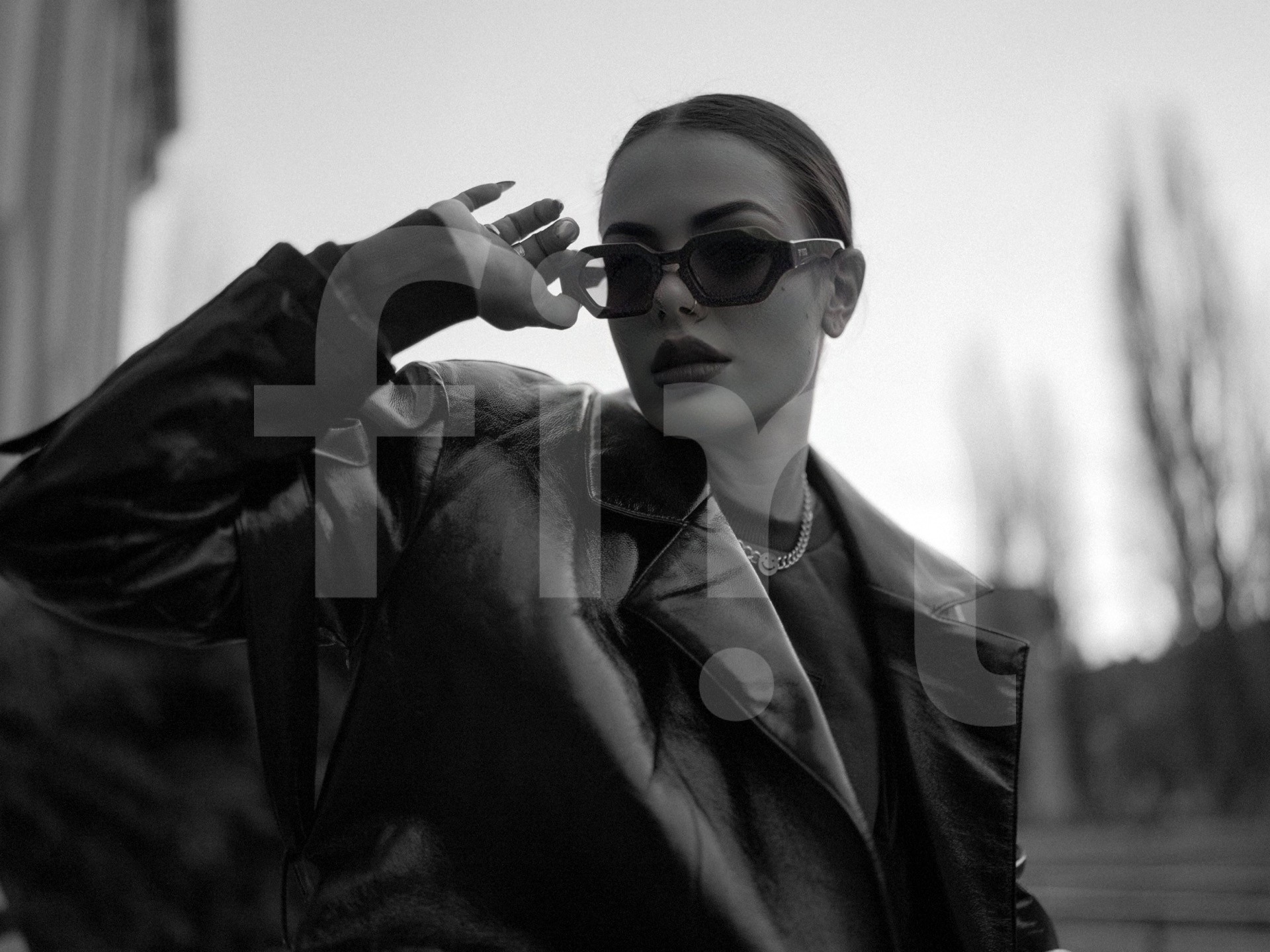 Black coat fashion girl with sunglasses and dark makeup black and white