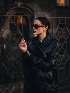 Black coat fashion girl with sunglasses and dark makeup