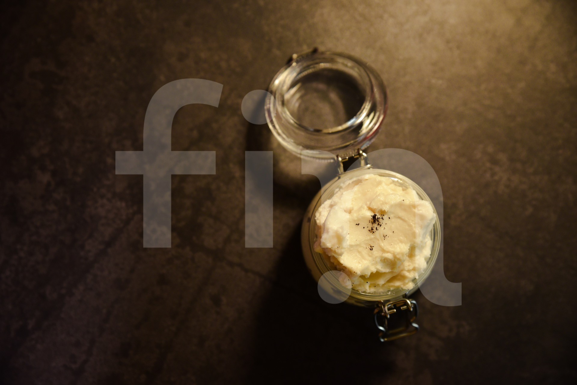 Natural cosmetics skin food shea butter on a black background