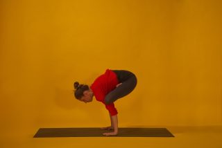 Yoga pose balancing on arms