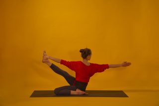 Yoga asana twist with stretched leg