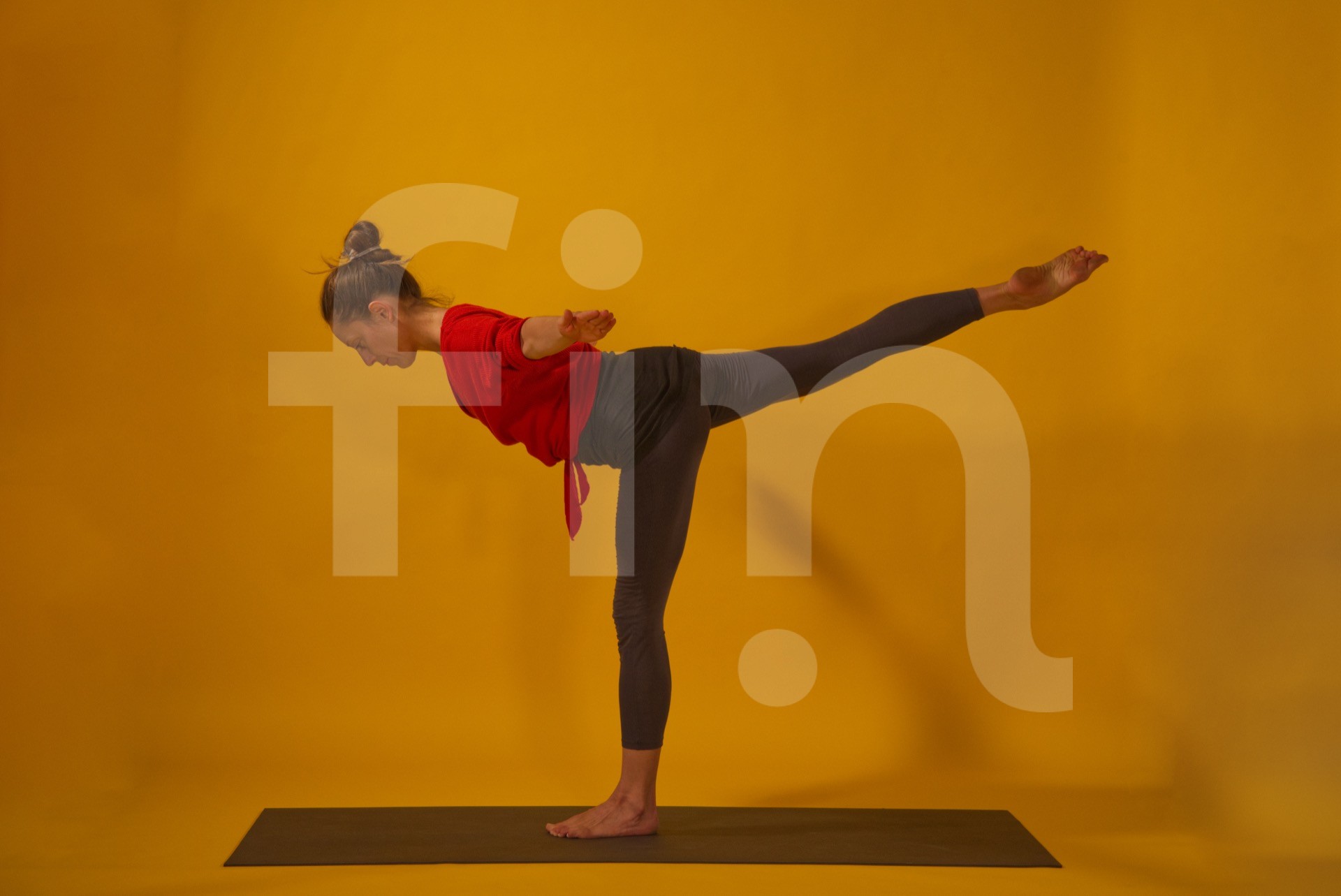 Virabhadrasana III warrior yoga pose with arms open aside