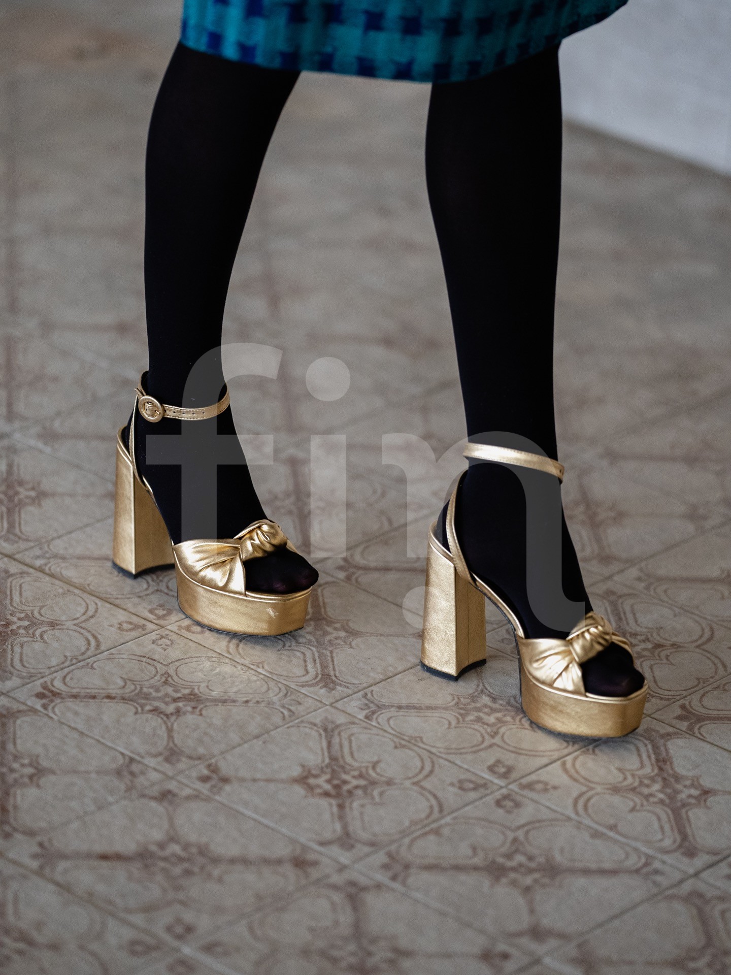Retro gold heels on black nylons